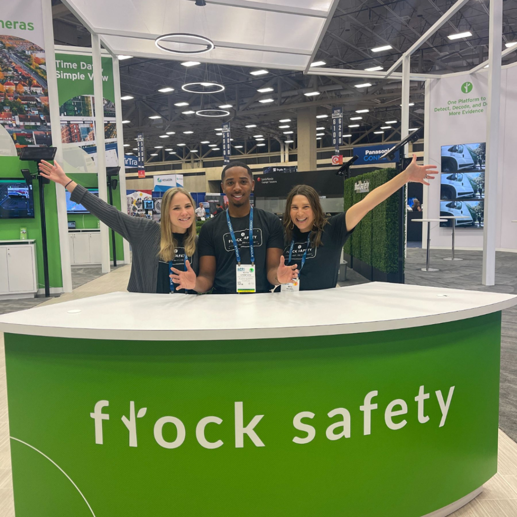 Meg and her team at a Flock Safety booth at a tradeshow